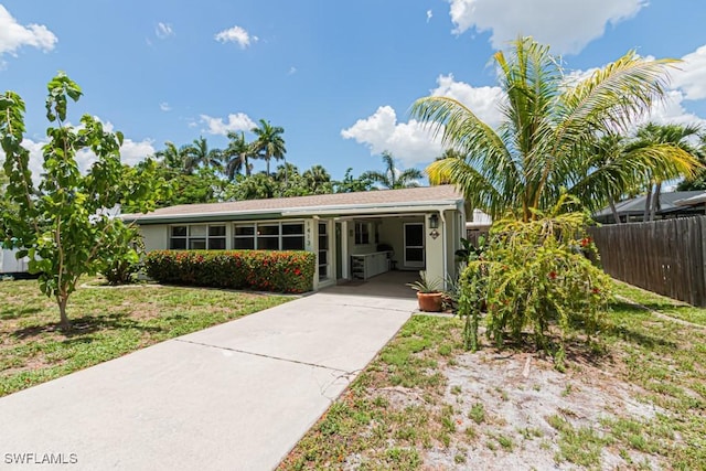 1413 Davis Dr, Fort Myers, FL 33919 - view of front of house featuring driveway and an attached carport