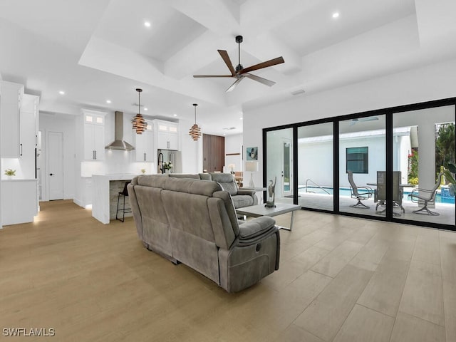 3475 3rd Ave SW, Naples, FL 34117 - living area featuring coffered ceiling, a ceiling fan, recessed lighting, light wood finished floors, and beamed ceiling