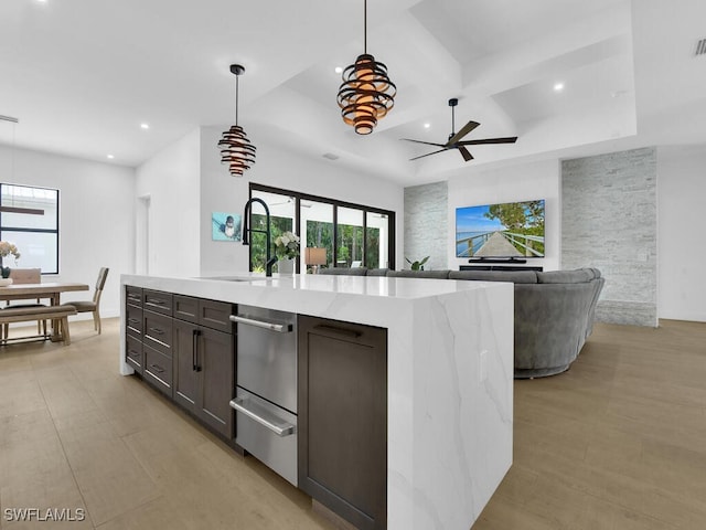 3475 3rd Ave SW, Naples, FL 34117 - kitchen featuring recessed lighting, coffered ceiling, open floor plan, hanging light fixtures, and a ceiling fan