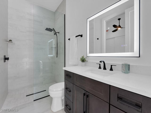 3475 3rd Ave SW, Naples, FL 34117 - bathroom with vanity, a tile shower, and a ceiling fan