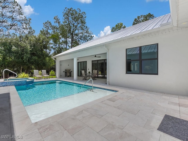 3475 3rd Ave SW, Naples, FL 34117 - view of swimming pool with a patio, a ceiling fan, a pool with connected hot tub, and area for grilling