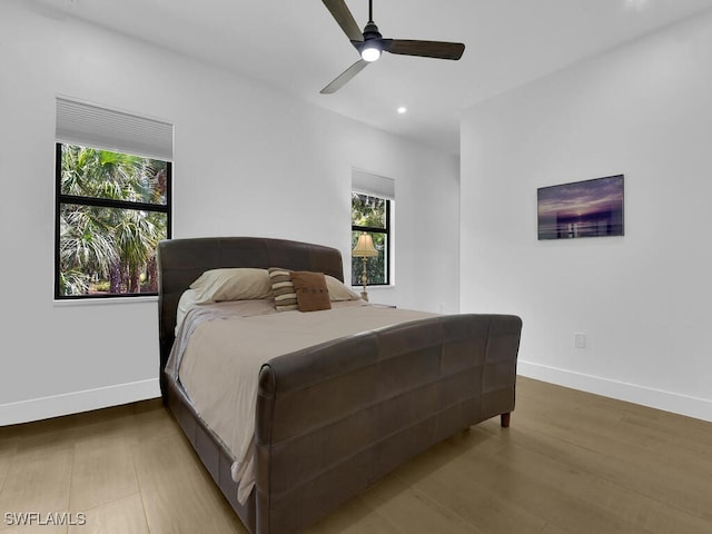 3475 3rd Ave SW, Naples, FL 34117 - bedroom featuring multiple windows, recessed lighting, wood finished floors, and ceiling fan