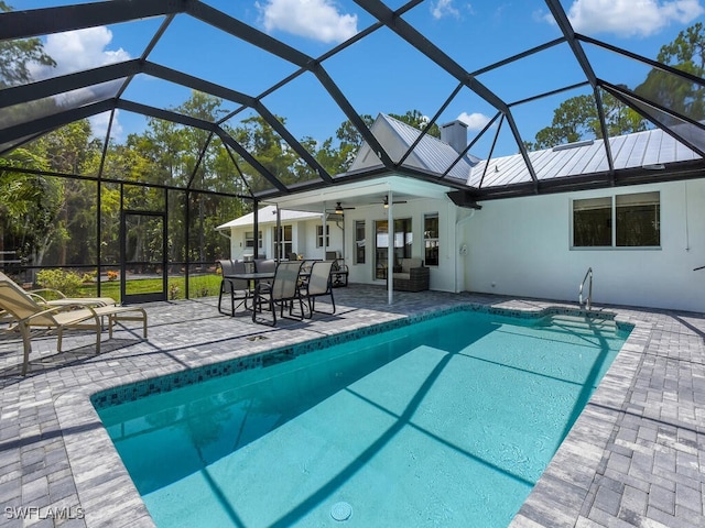 3475 3rd Ave SW, Naples, FL 34117 - outdoor pool with ceiling fan, a patio, outdoor dining space, and a lanai
