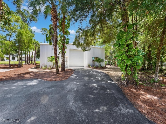 3475 3rd Ave SW, Naples, FL 34117 - view of front facade featuring driveway and an outdoor structure