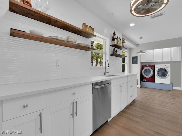 3475 3rd Ave SW, Naples, FL 34117 - kitchen featuring dishwasher, open shelves, washer and clothes dryer, white cabinets, and light countertops