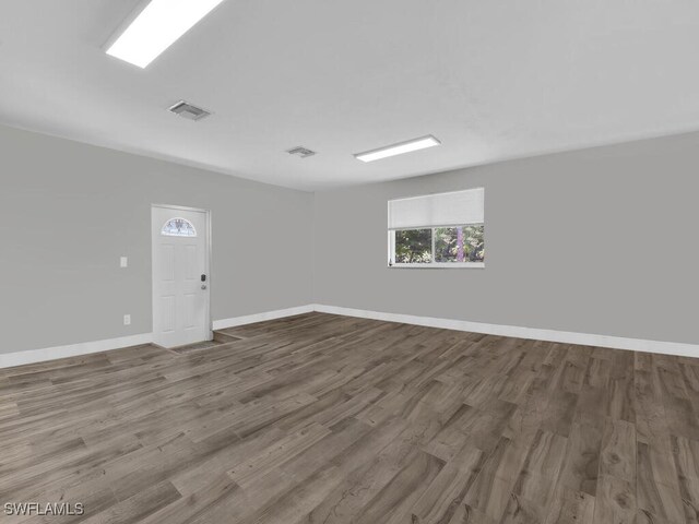 3475 3rd Ave SW, Naples, FL 34117 - unfurnished room with wood finished floors