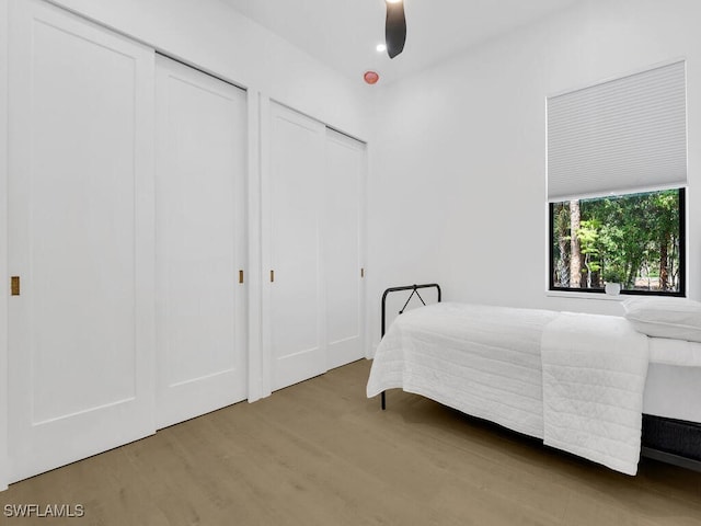 3475 3rd Ave SW, Naples, FL 34117 - bedroom with wood finished floors, two closets, and ceiling fan