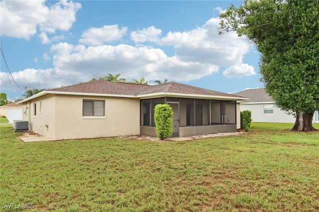 740 SW 5th St, Cape Coral, FL 33991 - rear view of property featuring a sunroom, a lawn, and stucco siding
