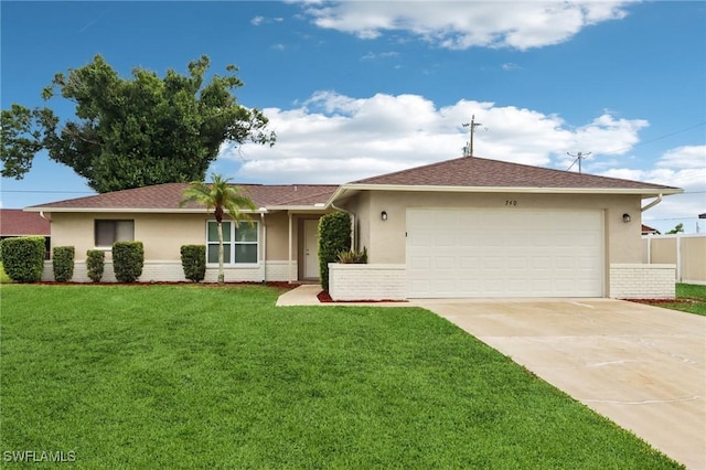 740 SW 5th St, Cape Coral, FL 33991 - ranch-style home with stucco siding, concrete driveway, an attached garage, and brick siding