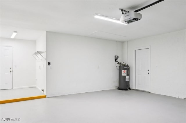 740 SW 5th St, Cape Coral, FL 33991 - garage featuring a garage door opener and electric water heater