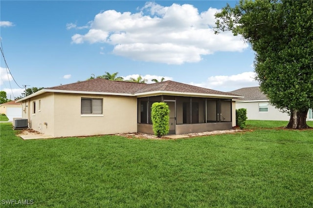 740 SW 5th St, Cape Coral, FL 33991 - rear view of house with a sunroom, a yard, and stucco siding