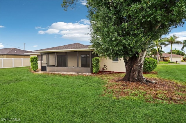 740 SW 5th St, Cape Coral, FL 33991 - back of house featuring a sunroom and stucco siding