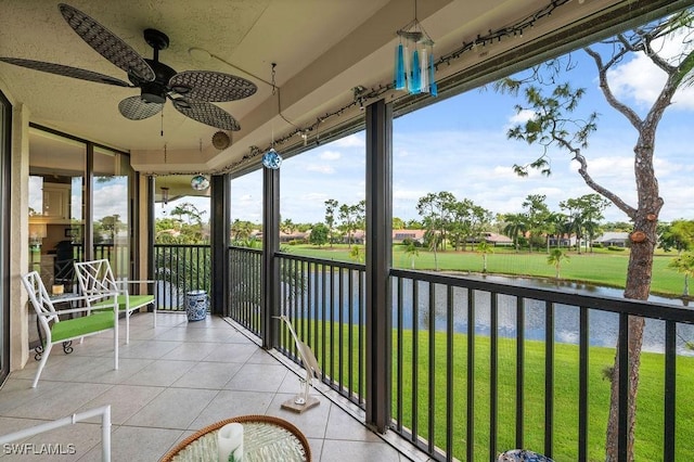 415 Augusta Blvd Unit 310, Naples, FL 34113 - balcony featuring a water view and ceiling fan