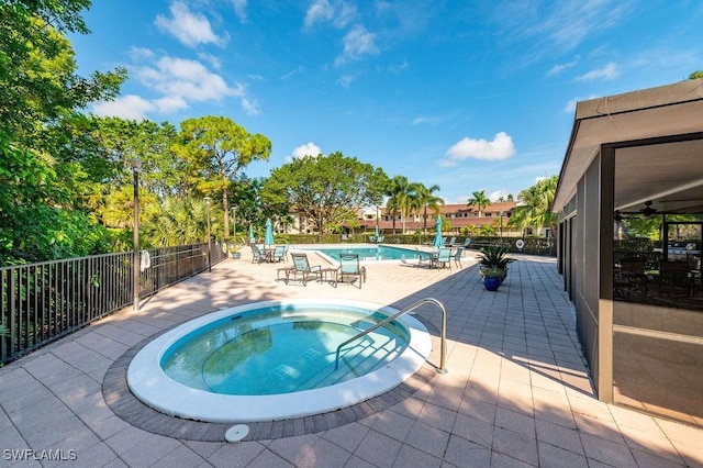 415 Augusta Blvd Unit 310, Naples, FL 34113 - community pool with a hot tub and a patio