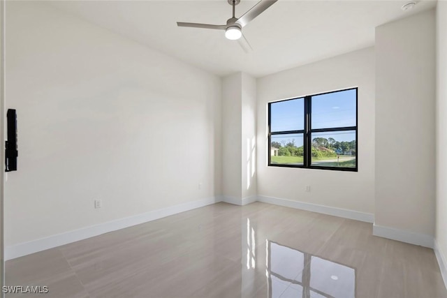 3115 41st St SW, Lehigh Acres, FL 33976 - spare room with a ceiling fan, light wood finished floors, and a smoke detector
