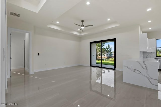 3115 41st St SW, Lehigh Acres, FL 33976 - unfurnished room with a ceiling fan, recessed lighting, and a raised ceiling