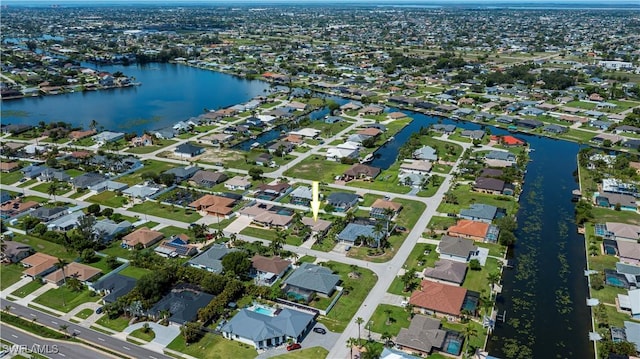 806 SW 4th Ave, Cape Coral, FL 33991 - aerial overview of property's location with a large body of water and nearby suburban area