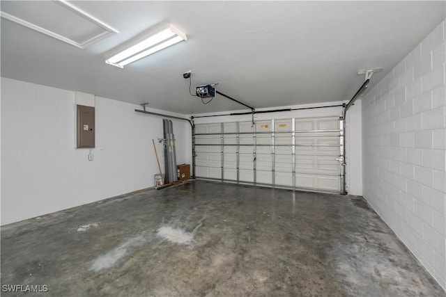 806 SW 4th Ave, Cape Coral, FL 33991 - garage with a garage door opener, electric panel, and concrete block wall