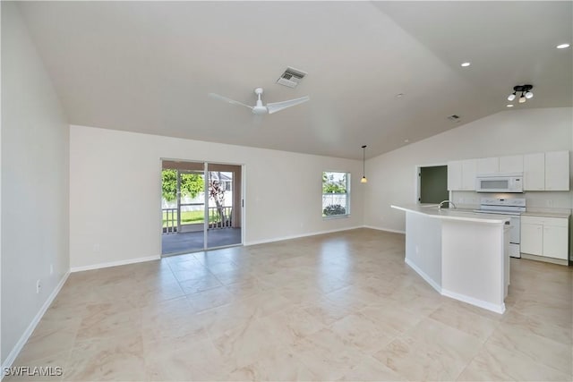 806 SW 4th Ave, Cape Coral, FL 33991 - unfurnished living room with high vaulted ceiling and a ceiling fan