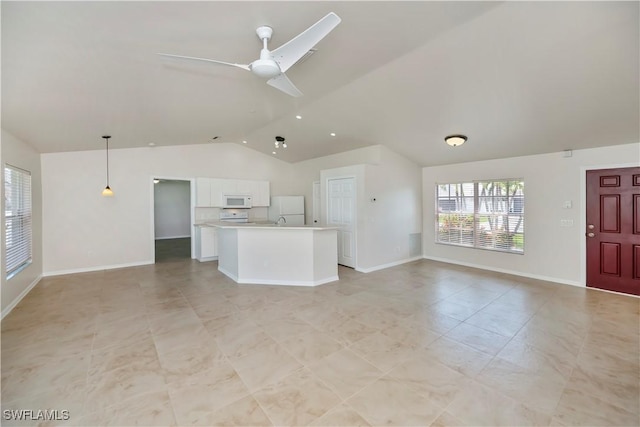 806 SW 4th Ave, Cape Coral, FL 33991 - unfurnished living room featuring a ceiling fan, light tile patterned flooring, and high vaulted ceiling
