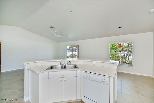 806 SW 4th Ave, Cape Coral, FL 33991 - kitchen featuring dishwasher, lofted ceiling, light countertops, hanging light fixtures, and white cabinetry