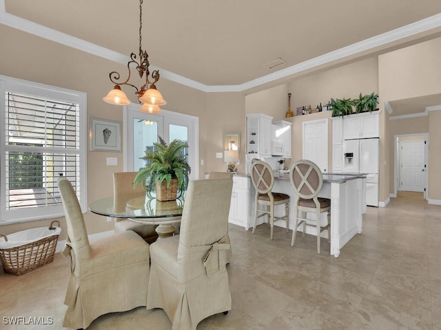 2546 SW 45th St, Cape Coral, FL 33914 - dining area with ornamental molding and a chandelier