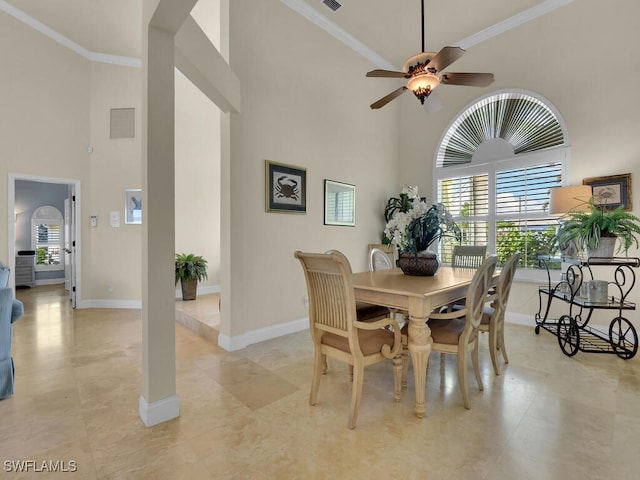 2546 SW 45th St, Cape Coral, FL 33914 - dining area featuring a high ceiling, plenty of natural light, ornamental molding, and a ceiling fan
