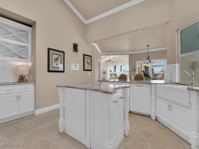 2546 SW 45th St, Cape Coral, FL 33914 - kitchen featuring white dishwasher, decorative backsplash, white cabinets, light stone counters, and lofted ceiling