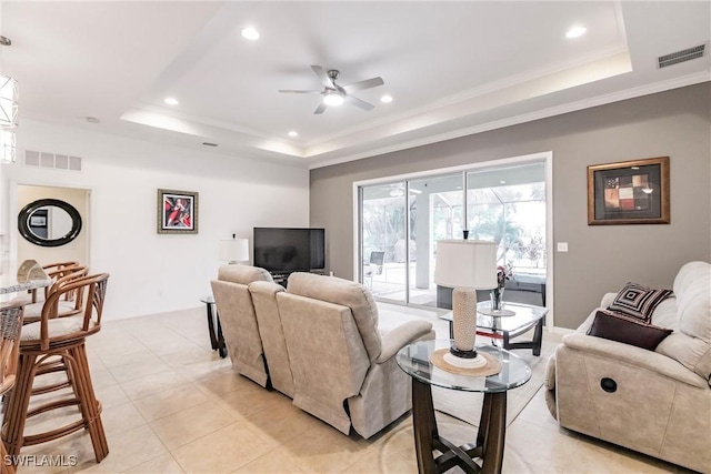 3260 Magnolia Landing Ln, North Fort Myers, FL 33917 - living room featuring a raised ceiling, ceiling fan, recessed lighting, light tile patterned floors, and ornamental molding