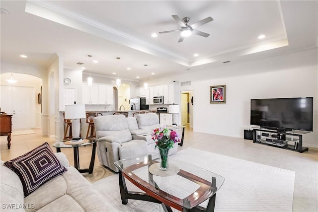 3260 Magnolia Landing Ln, North Fort Myers, FL 33917 - living area featuring arched walkways, recessed lighting, ceiling fan, light tile patterned flooring, and crown molding