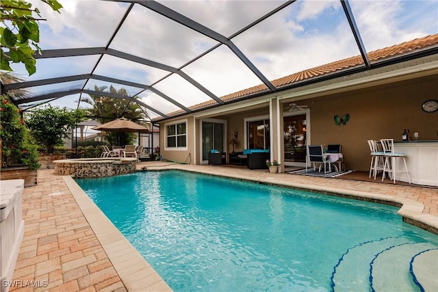 3260 Magnolia Landing Ln, North Fort Myers, FL 33917 - view of pool featuring a patio area, outdoor lounge area, a pool with connected hot tub, a ceiling fan, and glass enclosure