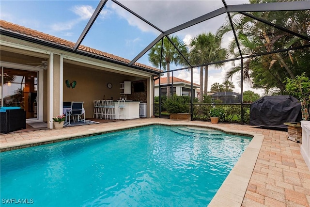 3260 Magnolia Landing Ln, North Fort Myers, FL 33917 - outdoor pool featuring a patio, glass enclosure, and a grill