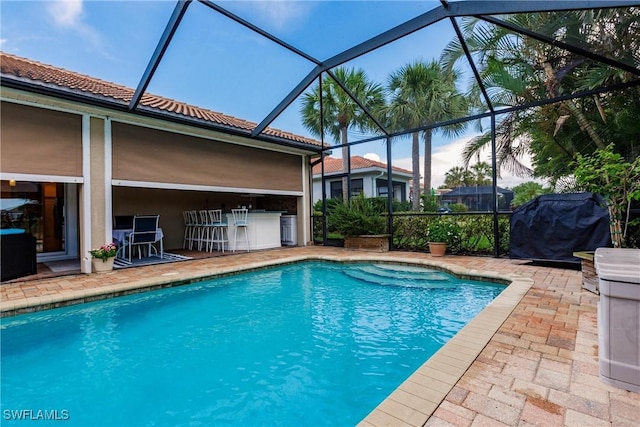 3260 Magnolia Landing Ln, North Fort Myers, FL 33917 - swimming pool featuring a patio area, glass enclosure, and grilling area