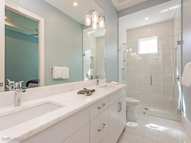 130 Burning Tree Dr, Naples, FL 34105 - bathroom with a shower stall, double vanity, ensuite bath, recessed lighting, and tile patterned flooring