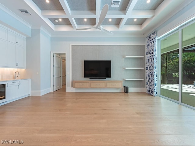 130 Burning Tree Dr, Naples, FL 34105 - unfurnished living room featuring coffered ceiling, light wood-style flooring, beamed ceiling, recessed lighting, and beverage cooler