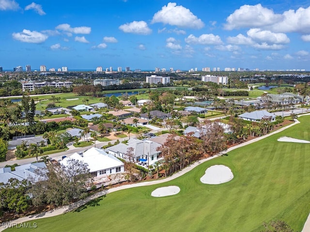 130 Burning Tree Dr, Naples, FL 34105 - aerial view of city skyline, a local golf course, and a large body of water