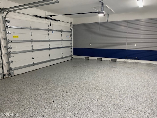 130 Burning Tree Dr, Naples, FL 34105 - garage featuring a garage door opener