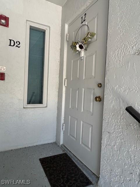 9950 Sailview Ct Unit 12, Fort Myers, FL 33905 - entrance to property featuring stucco siding