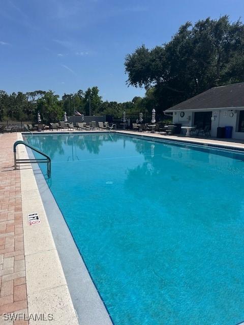 9950 Sailview Ct Unit 12, Fort Myers, FL 33905 - community pool featuring a patio area