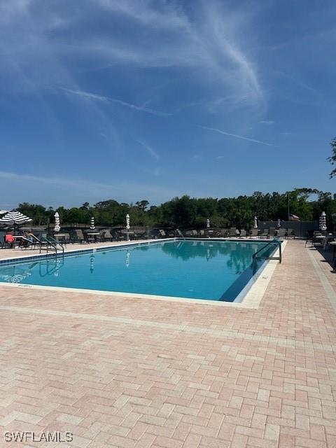 9950 Sailview Ct Unit 12, Fort Myers, FL 33905 - community pool with a patio area