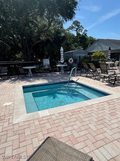 9950 Sailview Ct Unit 12, Fort Myers, FL 33905 - view of swimming pool with a patio and a pool