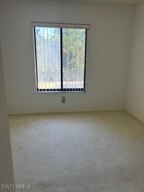 9950 Sailview Ct Unit 12, Fort Myers, FL 33905 - carpeted empty room featuring baseboards