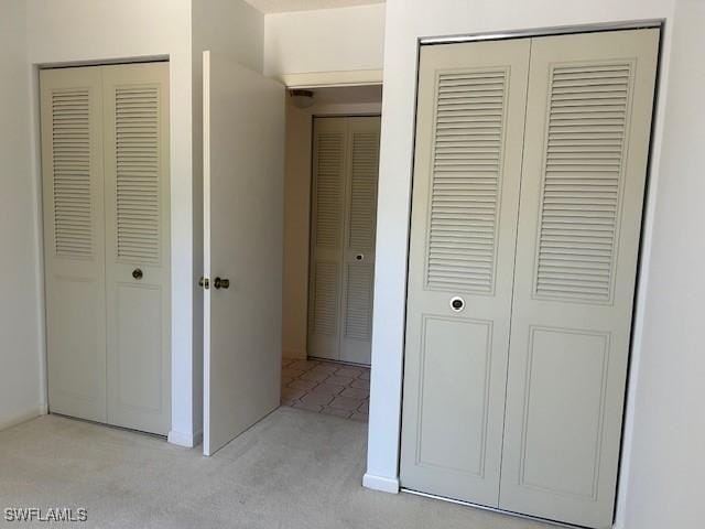 9950 Sailview Ct Unit 12, Fort Myers, FL 33905 - unfurnished bedroom with light colored carpet and a closet