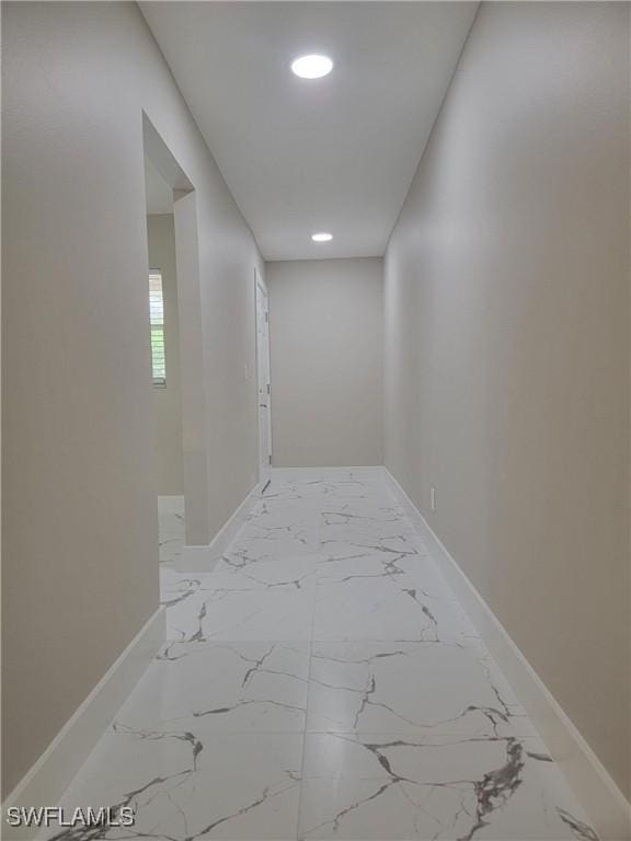 709 Landover Cir Unit 203, Naples, FL 34104 - corridor with recessed lighting and marble finish floors