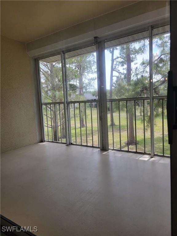 709 Landover Cir Unit 203, Naples, FL 34104 - unfurnished sunroom with healthy amount of natural light