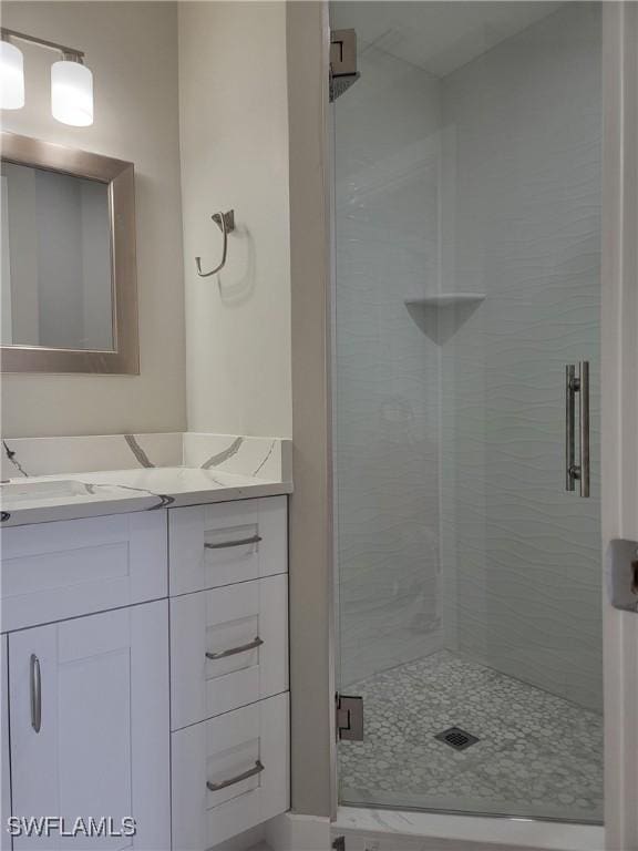 709 Landover Cir Unit 203, Naples, FL 34104 - full bathroom with vanity and a shower stall