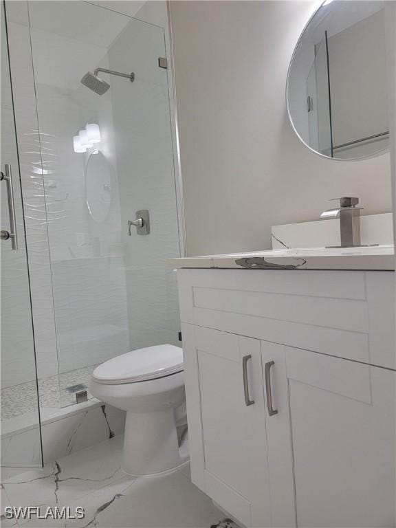 709 Landover Cir Unit 203, Naples, FL 34104 - bathroom with a shower stall, vanity, and marble finish flooring