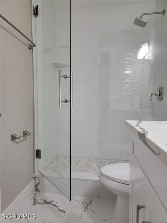 709 Landover Cir Unit 203, Naples, FL 34104 - bathroom with a stall shower, marble finish floors, and vanity