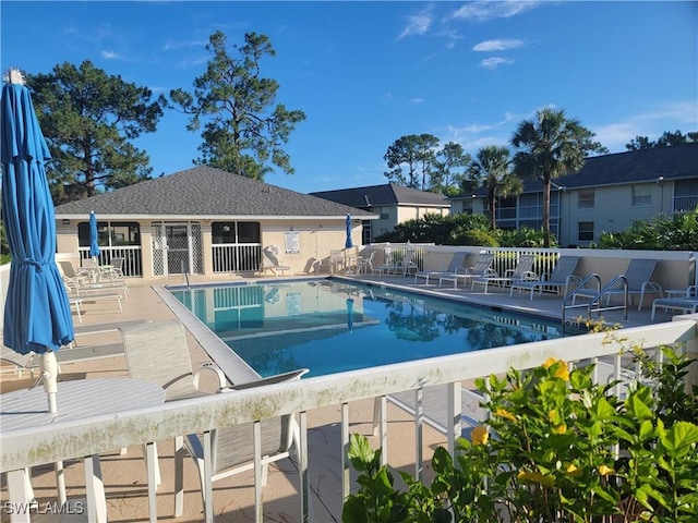 709 Landover Cir Unit 203, Naples, FL 34104 - community pool featuring a patio area