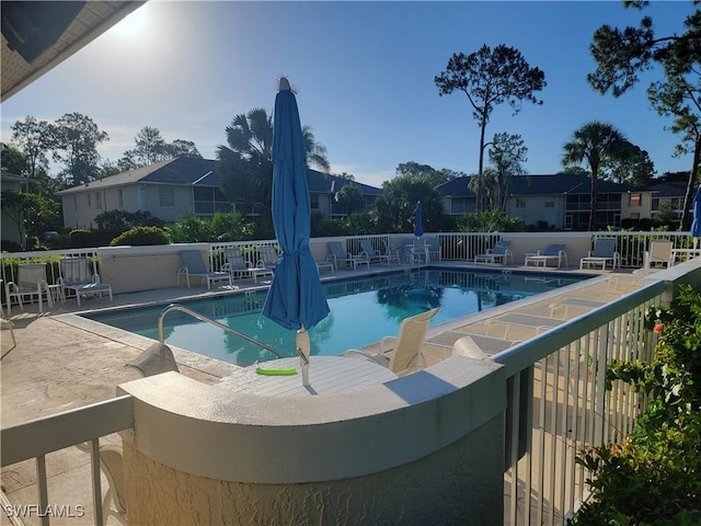 709 Landover Cir Unit 203, Naples, FL 34104 - community pool with a patio area